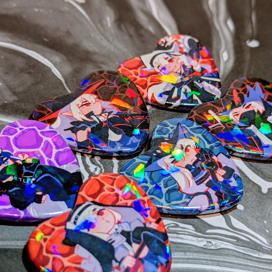 A set of holographic heart pinback button of the characters in Arknights. The characters from left to right, top to bottom are Andreana, Gladiia, Specter Unchained, Specter, Skadi and Ulpianus.